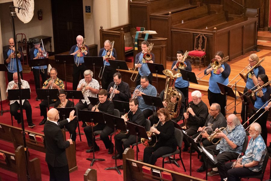 Professor Emeritus Dr. Charles H. Wood III (bottom left) conducts the premiere of his Fanfare for America with a combined brass choir on Nov. 6 at First United Methodist Church in Santa Barbara, Calif. Members of the various ensembles that performed earlier in the night came together to bring Wood’s piece to life.