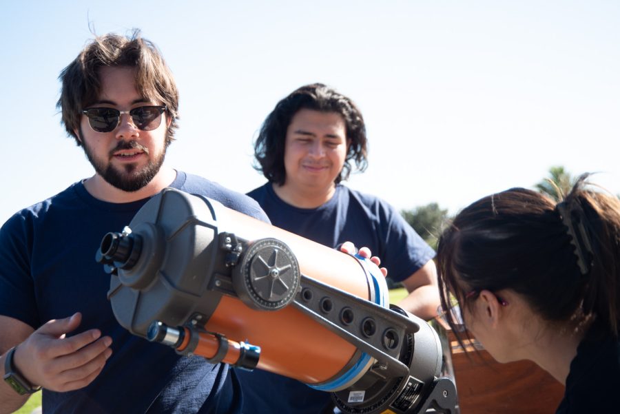 Astronomy Club members (from left) Rafael Cottom, Frank Salazar, and Kristal Lopez collaborate to set up a telescope for viewing the sun on Nov. 15 at City College’s Club Day in Santa Barbara, Calif. The club meets every second Saturday of the month at the Santa Barbara Museum of Natural History to view planets and stars.