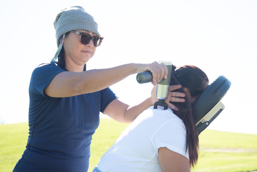 Jo Peng massages her daughter, Jinny Peng, as a demonstration for the Healing Hands Club on Nov. 15 at City College in Santa Barbara, Calif. Jo Peng emphasized the dynamics between body relaxation and controlled breathing exercises.