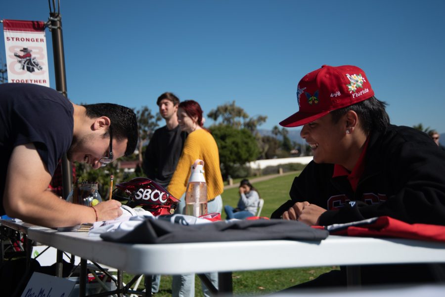City College Student Edgar Hernandez signs up for Lacrosse Club as Head Coach Gabriel Sabillo (right) strikes up a conversation on Nov. 15 in Santa Barbara, Calif. Sabillo hopes that adding more members to his club will increase the chances of establishing an official SBCC Lacrosse Team.