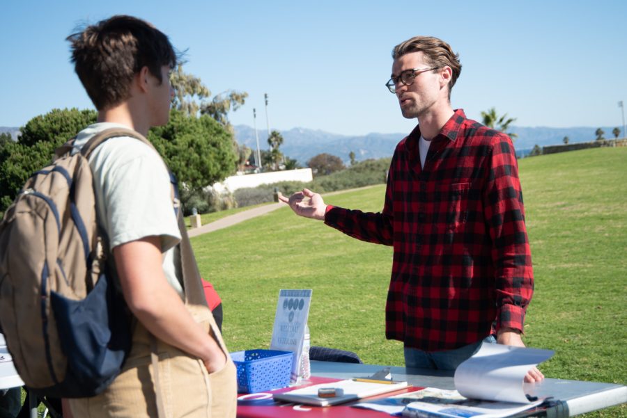 Riley McCaffery (right) explains the values and mission of City College Veterans Club to a student on Nov. 15 in Santa Barbara, Calif. McCaffery stressed the importance of bringing awareness to support systems needed by local veterans to City College students.