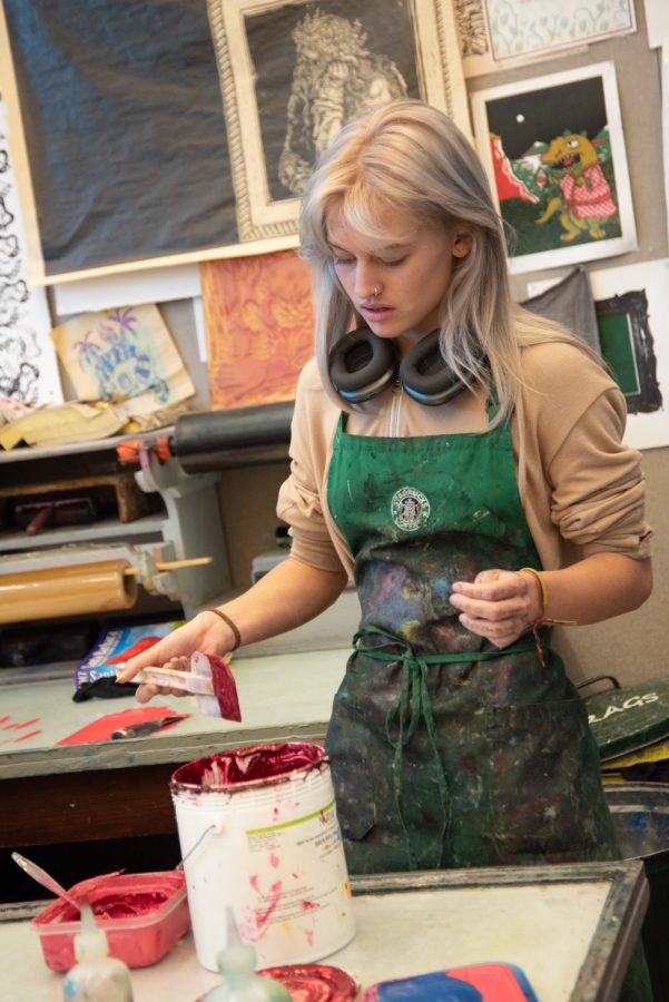 Art student Gigi Macioce mixes deep red ink to use on a print on Nov. 17 at City College in Santa Barbara, Calif. Color selection was discussed earlier during the class as an important part of managing contrast in completed prints.