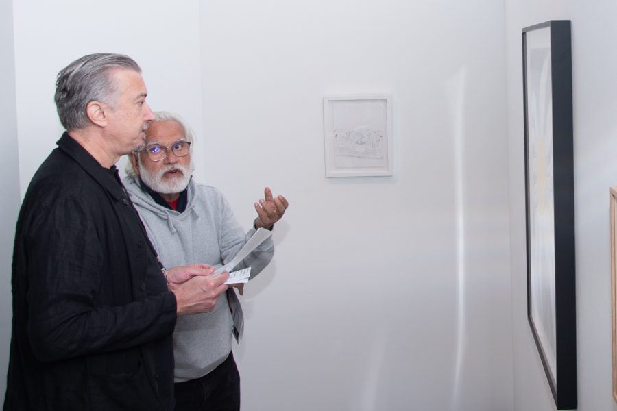 Atkinson Gallery Director John Connelly reviews “The Hope I” by Mark Thomas Gibson (2021) with a gallery guest on Nov. 3 in Santa Barbara, Calif. Connelly greeted members of the community and ensured a smooth opening of the new exhibit.