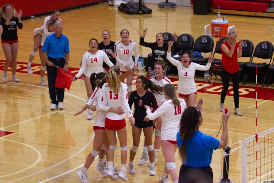 The Vaqueros women’s volleyball team celebrates their win against Saddleback on Nov. 19 in the Sports Pavillion at City College in Santa Barbara, Calif. Vaqueros won the match 3-1.