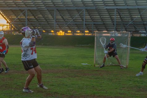 Marshall Spurlock taking a shot on Coach Sabillo as they warm up on Thursday, Nov. 17 at Dos Pueblos high school in Santa Barbara, Calif. Spurlock has written every single offensive play so far this year and scored three goals in their first game of the off-season.