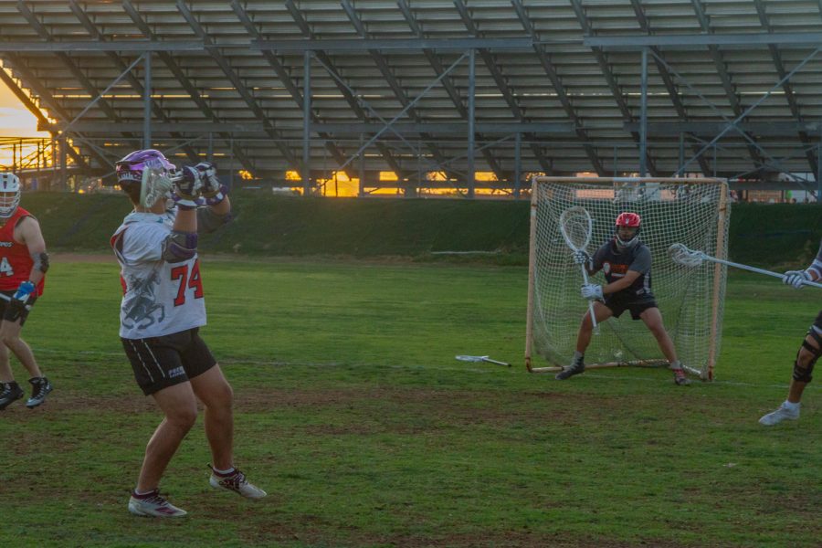 Marshall Spurlock taking a shot on Coach Sabillo as they warm up on Thursday, Nov. 17 at Dos Pueblos high school in Santa Barbara, Calif. Spurlock has written every single offensive play so far this year and scored three goals in their first game of the off-season.