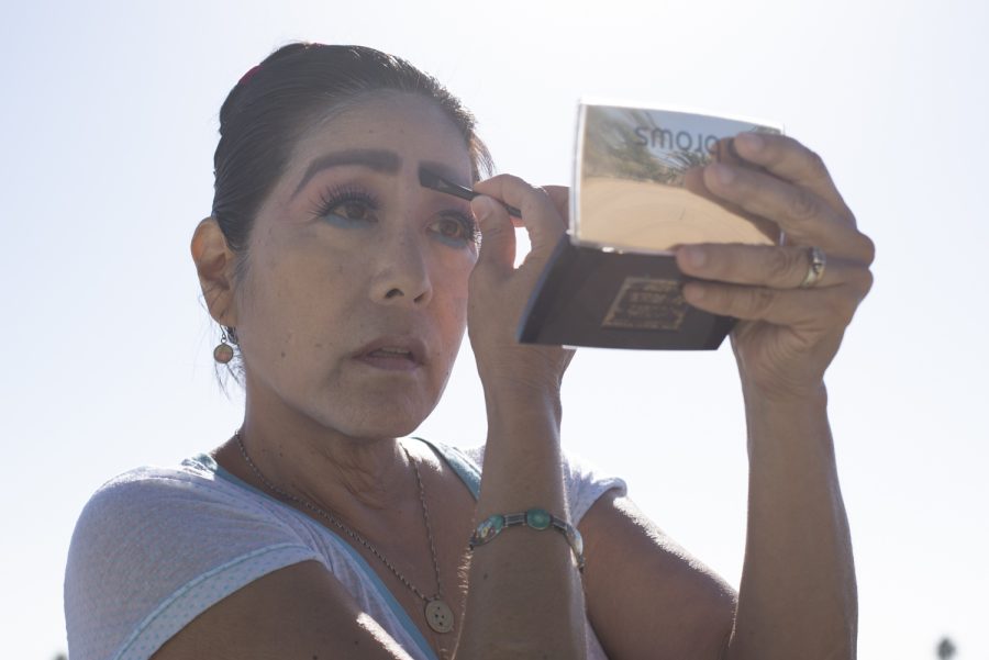 Deborah Cristobal darkens her eyebrows while applying the makeup she wears to transform for the role of Yuko Matsumura on Oct. 27 in Santa Barbara, Calif. Cristobal emphasized a fine attention to detail as she went through the several steps needed to prepare her face in a traditional Japanese style.