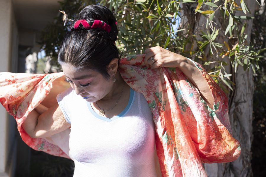 Deborah Cristobal changes into her traditional Japanese kimono on Oct. 27 in Santa Barbara, Calif. When putting on the garment, Cristobal made sure that the right side wrapped over the left, as is customary in Japan when worn by the deceased.