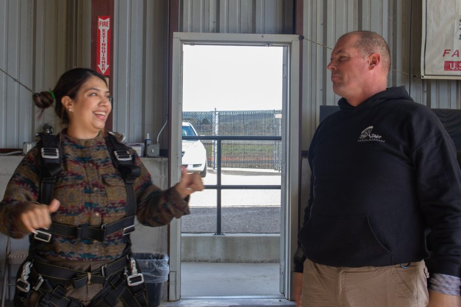 Skydiving instructor Tom Pecharich(right) giving his jumper, Paula Bran(left), the rundown on what she is going to do when they jump out of the plane on Dec. 5 at Skydive Santa Barbara in Lompoc, Calif. “Okay what you’re going to do when we jump is, feet out and under the plane, head back to my right shoulder and hips forward,” he said.