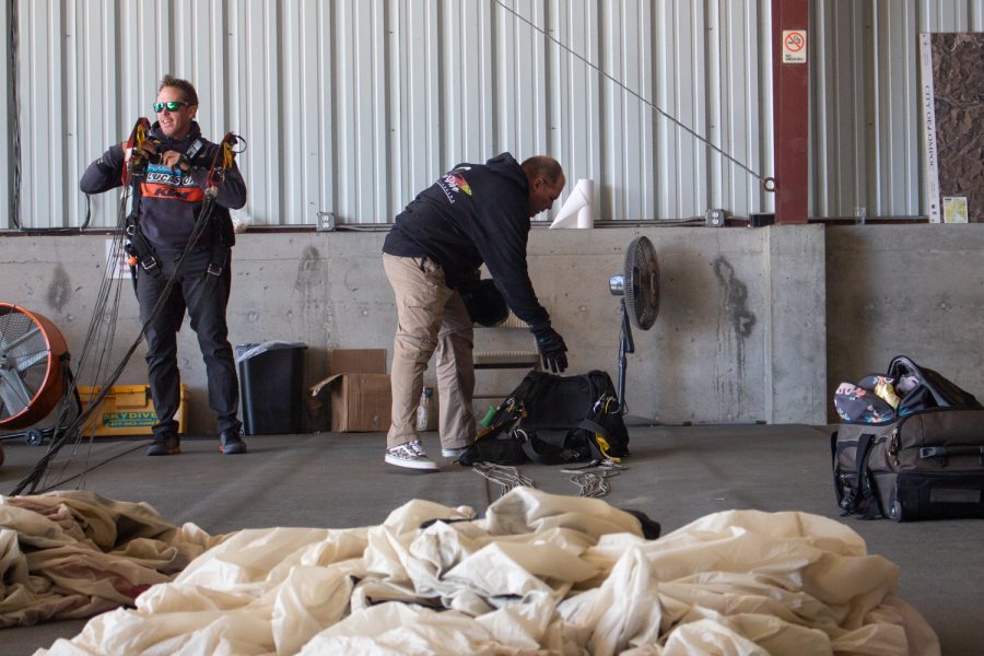 Instructor Tom Pecharich drops off his parachute pack, so the packers can repack the chute on Nov. 20 at Skydive Santa Barbara in Lompoc, Calif. Out of the 22 years Pecharich has been skydiving he has only had to pull his reserve chute three times.