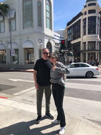 Sofia Stavins and her dad visiting Los Angeles from her hometown in Lake Zurich, Chicago for the first time after deciding to move to California. Stavins and her dad smile happily on the street corner in Beverly Hills Calif.