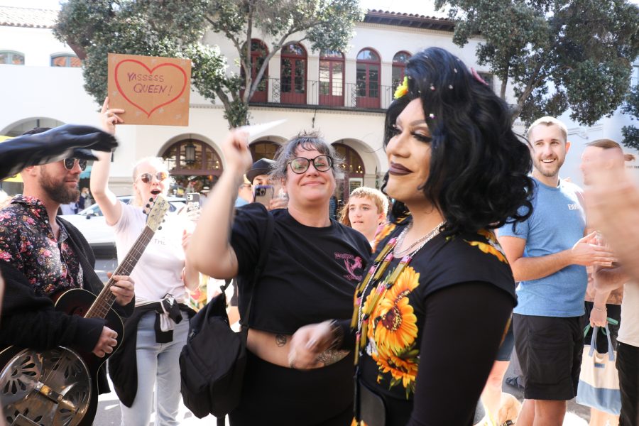 Angel Dmon comes out of The Crafters Library after Story Time with Miss Angel to thank her supporters during the protests on Feb. 11 in Santa Barbara, Calif.