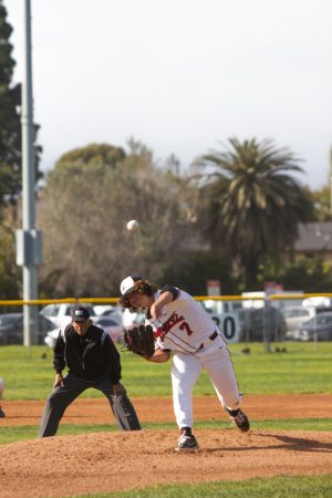 Starting left hand pitcher Jake Villar (No. 7) pitches to a Cuesta College batter with the Santa Ynez mountains as a backdrop to the Vaqueros vs. Cougars game on Tuesday, Feb. 21 in Santa Barbara Calif.