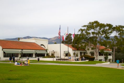 Flags swaying and mountains standing in the distance, the Luria Library and Cartwright Learning Resources Center building is located on West Campus. The library was populated by students on the go or stopping at the Great Meadow for lunch on Friday, Feb. 3.