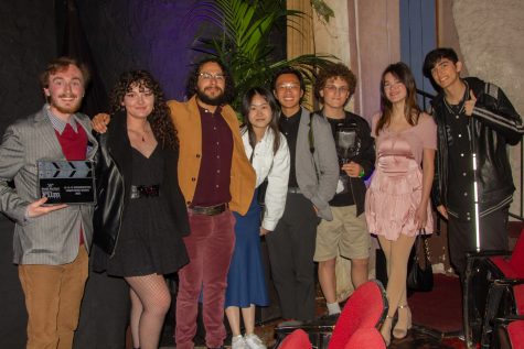 The cast and behind the scenes workers on the student film “Attack of the Macro-Plastic Monster” stand together after celebrating their accomplishments at the Santa Barbara International Film Festival on Saturday, Feb. 18, 2023 at the Granada Theatre in Santa Barbara Calif.