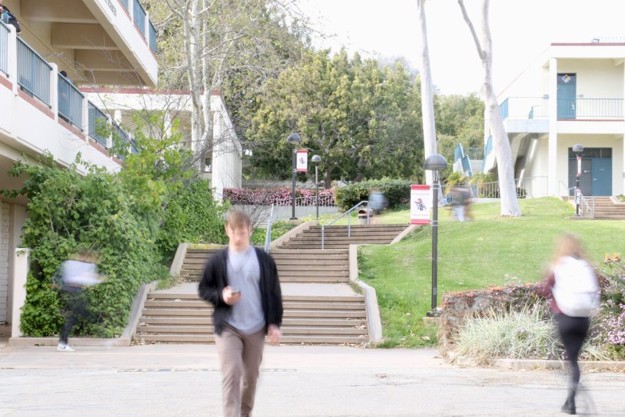 Students walk nearby the Friendship Plaza and Campus Store on Thursday, Feb. 16 in Santa Barbara Calif.