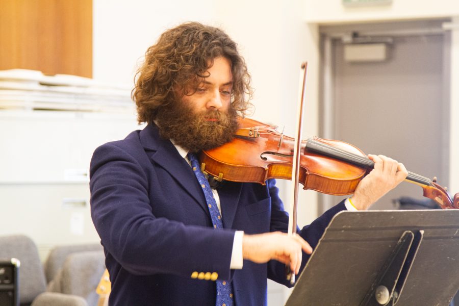 Moon Man Whitehead pulls the bow of his viola to create a drone that underlies the melodies of Marin Marais Cinq Danses Francaises Anciennes on Friday, Feb. 24 at SBCC in Santa Barbara, Calif. The violist performed the complex French piece in a duo with John Douglas on piano.