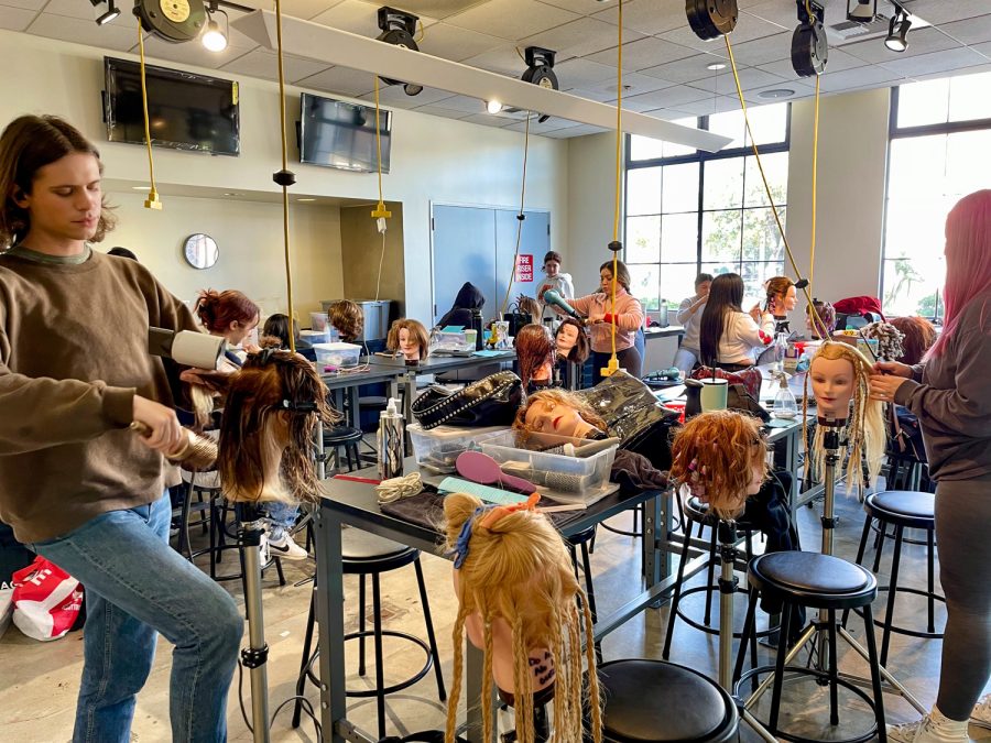 In+the+working+station%2C+the+cosmetology+students+work+on+mannequin+heads.+Each+student+is+styling+each+mannequins+hair+as+a+way+of+practice+on+Monday%2C+Feb.+27.