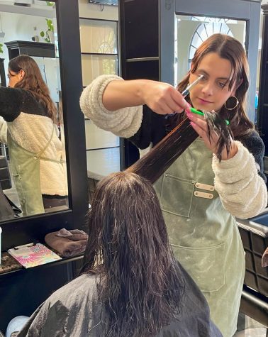 Cosmetology academy student hairdresser Kendall Amerson cutting a clients hair. She works carefully and accurately to get the right cut on Monday, Feb. 27.