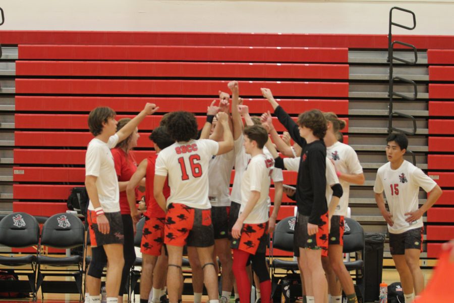 The City College men’s volleyball team join together with their hands raised during a game against Antelope Valley College on Friday, March 17 in the Sports Pavillion at City College in Santa Barbara Calif. This was after the second set and right before the third, they finished out the second set with an 11 point lead.