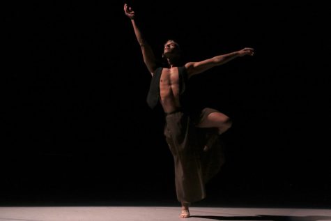 Joshua Estrada-Romero gazes up during his choreographed piece titled "Rise - Fall - Rise" on April 14 at the Garvin Theatre in Santa Barbara, Calif. The piece guides the audience through an emotional and captivating ballad, enhanced by Estrada-Romano's expressive movements.
