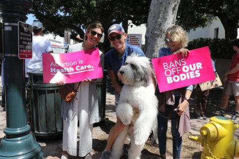 From left, Abby Sassaman, Ian Black, Dianne Black and Brady Picket on the corner of State street and Figueroa street on April 15 in Santa Barbara, Calif. Dianne holds a sign reading, "Bans off our bodies", as Abby's sign reads, "Abortion is Heath Care", distributed by Planned Parenthood. 