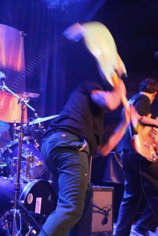 Mikey Netka of Strange Case knows how to make an exit during the Shabang Battle of the Bands tour in Santa Barbara, Calif. At the end of their set, Netka smashes his guitar on stage as he exits.