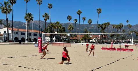 Irey Sandholdt (No.9) hit the ball up for her partner to hit over the net on April 21 at West Beach in Santa Barbara, Calif. Here, Bakersfield waits for the pair to finish their moves.