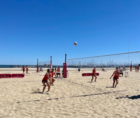 Paige Rudi(No.12) is hitting the ball up in the air on April 21 on West Beach in Santa Barbara, Calif. Bakersfield is rushing over to prepare to receive the ball.