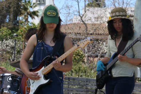 Michela Gunther (left) and Aurora Robathan-Wu lock in during Chatterbox's performance during the Honors Sustainability Festival on Friday, April 21 in Santa Barbara, Calif. The band is based out of Isla Vista, Calif.