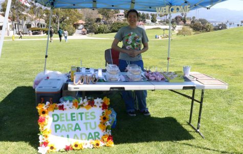 Atziry Mendonza showcases her sweet treats booth at the Honors Sustainability Festival on Friday, March 21 in Santa Barbara, Calif. Mendonza sold assortments of arroz con leche, tres leches, and strawberries and cream.