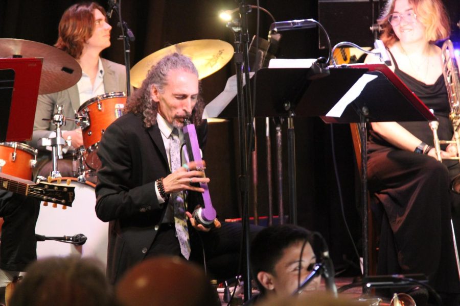 John Daversa demonstrates his skills with the Electronic Valve Instrument, or EVI, while simultaneously fixing its MIDI outputs on the floor on Monday, March 20 at SOhO Lounge, Santa Barbara, Calif. Though the EVI has a similar fingering pattern to woodwind instruments, Daversa, a trumpet player, is an acclaimed expert.