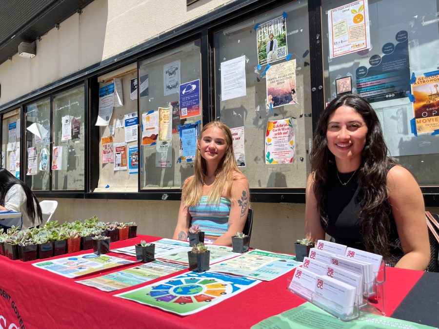 ASG commissioners Jackie Estrada (right) and Paige White (left) handing out succulents on Thursday, April 20 on East Campus in Santa Barbara, Calif. As the commissioner of sustainability, White attended every event held by ASG that celebrated Earth Week.