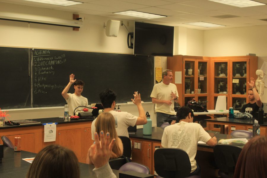 The advisor of the biology club, Blake Barron, stands to the left of Jack Foster, the president of the club on April 7 in the Earth Science building at City College in Santa Barbara, Calif. Baron asks the class to raise their hands if anyone has taken CHEM 155 OR CHEM 156.