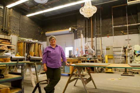 Patricia Frank, co-chair of theater arts and director of design and technology, smiles as she stands in the set design room where she teaches students the inner workings of set design. Frank gives a tour of the behind the scenes of the theater department on Monday, April 10, 2023.