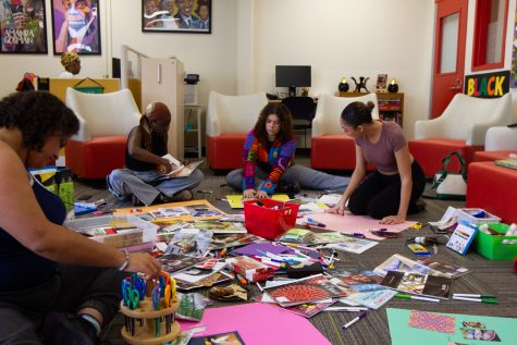 Bringing students of the Umoja program together, a scrapbooking afternoon was hosted where students crafted, listened to music, and created vision boards together. From left, Zacque Beltz, Diarra Pouye, Stella Stretch, and Jaili Reed work in a group on their own vision board collage on Tuesday, Feb. 28 at City College.