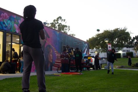 On the left, Elijah Garrett throws the football with 9-year-old Josiah Megzs outside of Umoja. The Umoja program hosted a 'Black History 365' event which welcomed the community to celebrate Black History Month on Wednesday, Feb. 15, 2023 at City College.