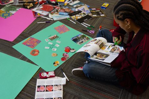 Zia Pilar Frausto cuts out a picture from a magazine while carefully crafting her vision board on Tuesday, Feb. 28 at City College.v