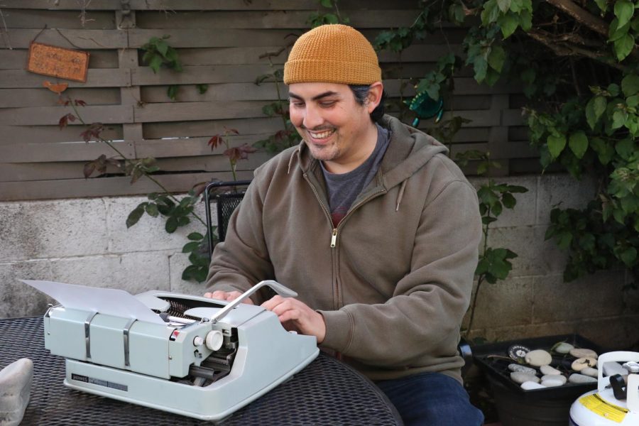 Andruw Martinez carefully crafts a poem on his type writer on May 10 in Santa Barbara, Calif. Martinez continues his love of writing and poetry on City Colleges campus.