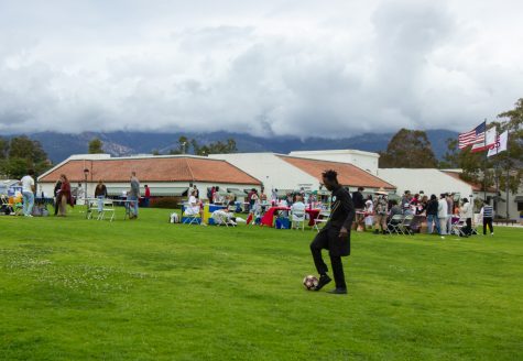 Chernor Diallo, president of ASG, steadies a soccer ball before passing it to his fellow classmates on Thursday, May 4 in Santa Barbara, Calif. Diallo awarded the winning teams of ASG’s Olympics trophies during the "Unity in the Community" closing ceremony.