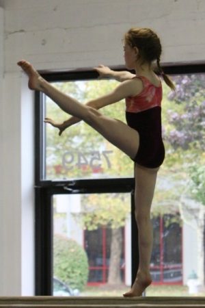 Delaney Newhouse balances on her toes on a beam in Gaithersburg, Md. The four inch beam became an all-too familiar metaphor for anxiety.