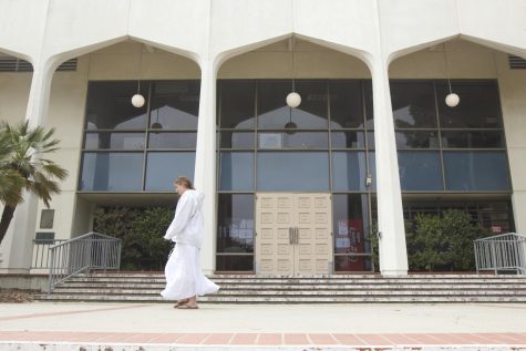 A student walks past City College's student services building in Santa Barbara, Calif. The student services building holds many resources for students, including the transfer center.