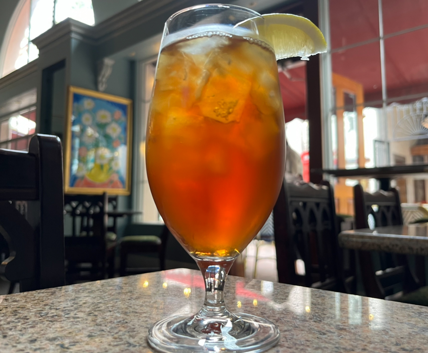 An iced tea creates drops of condensation around its glass at Petit Valentein on Tuesday, May 9 in Santa Barbara, Calif. The tea is made in-house and comes served with a slice of lemon.