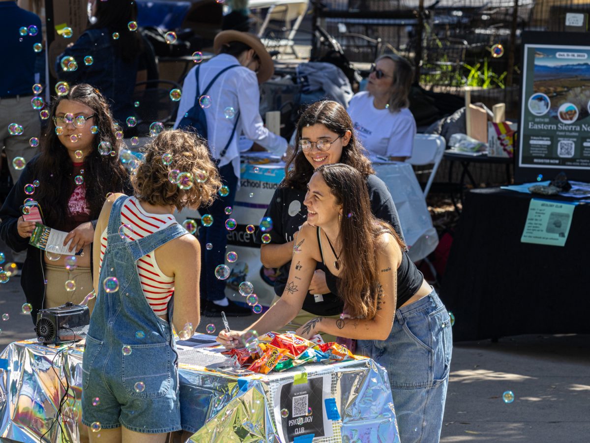 Natalia Morozova helps a student sign up for the psychology club on east campus during club day on Sept. 13 at City College in Santa Barbara Calif. The psychology club will be inviting Spencer Sherman, a clinical licensed psychologist, to speak on psychedelic psychotherapy this semester.