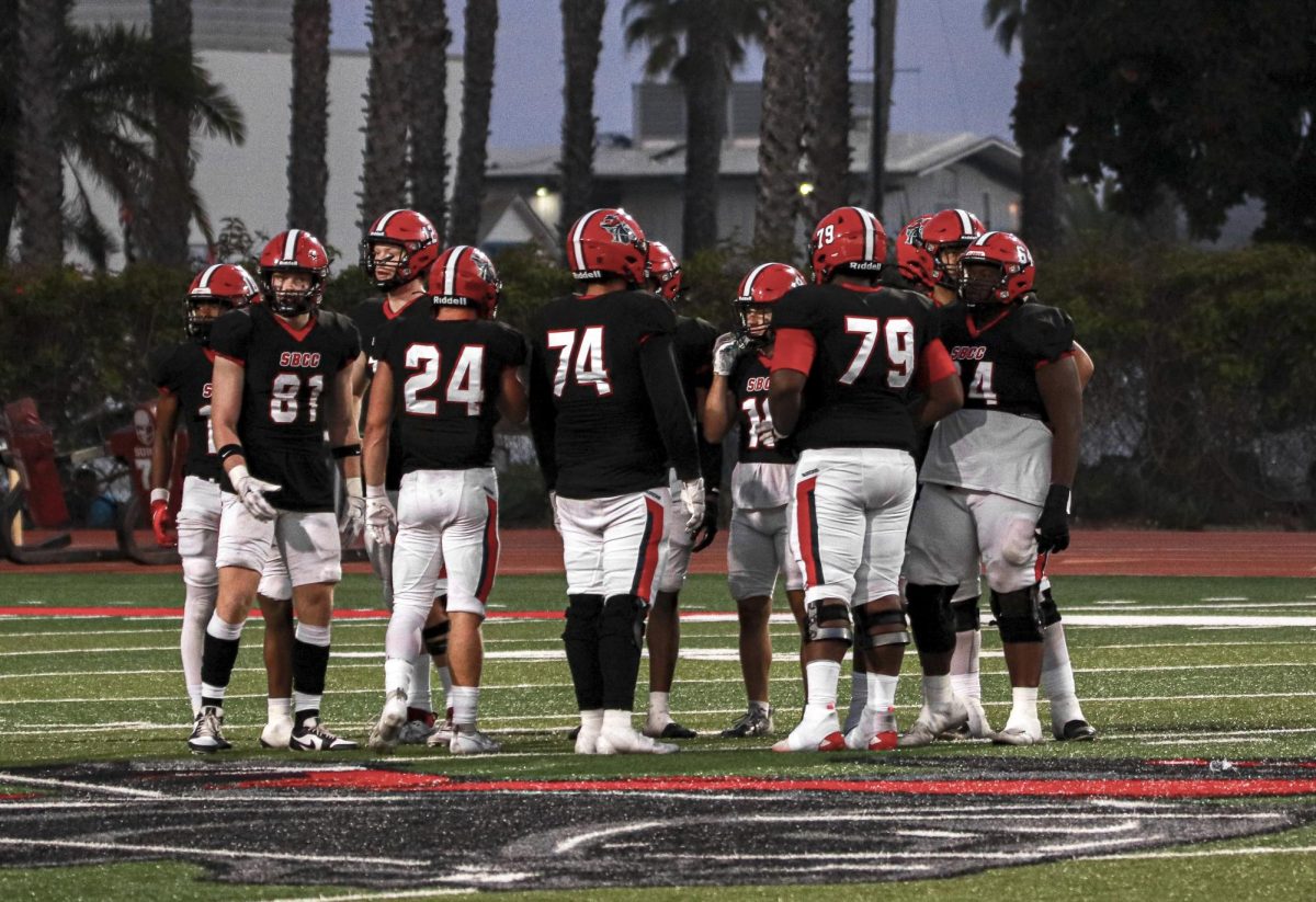 The Vaqueros offensive line huddles together to discuss the set play on Saturday, Sept. 23 against the College of the Canyons at La Playa Stadium in Santa Barbara, Calif. The Vaqueros are set to play again Saturday, Sept. 30 against Ventura College.