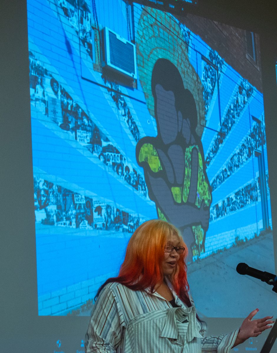 Cameron Patricia Downey begins her talk at Santa Barbara (Calif.) City College on Wednesday September 13, 2023 by sharing her start in the art world. Downey started her artist passion when her Mom signed her up for a summer art class in which she collaboated on this mural.