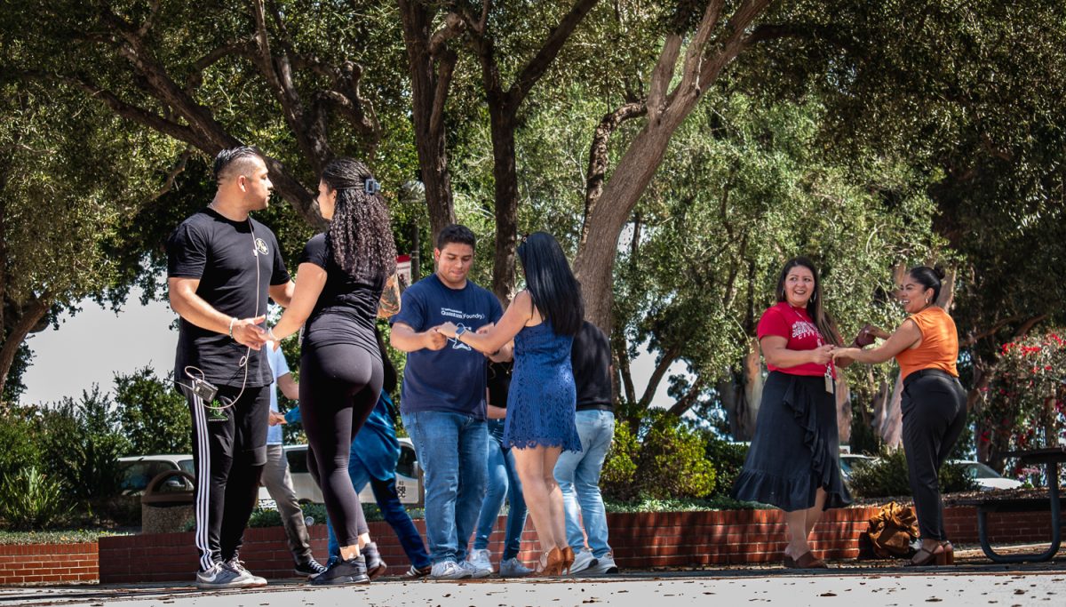 Community members pair off to celebrate Hispanic Heritage Month with a fun salsa dance lesson on Tuesday Septemper 19, 2023. The dance class was held in Memorial Plaza on east campus of City College in Santa Barbara, Calif.