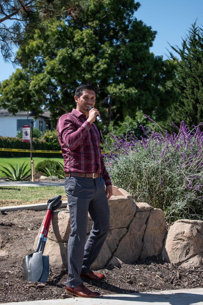 Sergio Lagunas, Raices
program coordinator at City College, reads plaque donated for the Raices program. The tree planting ceremony commenced the Raices program on Tuesday, Sept. 12 in front of the West Campus Center.