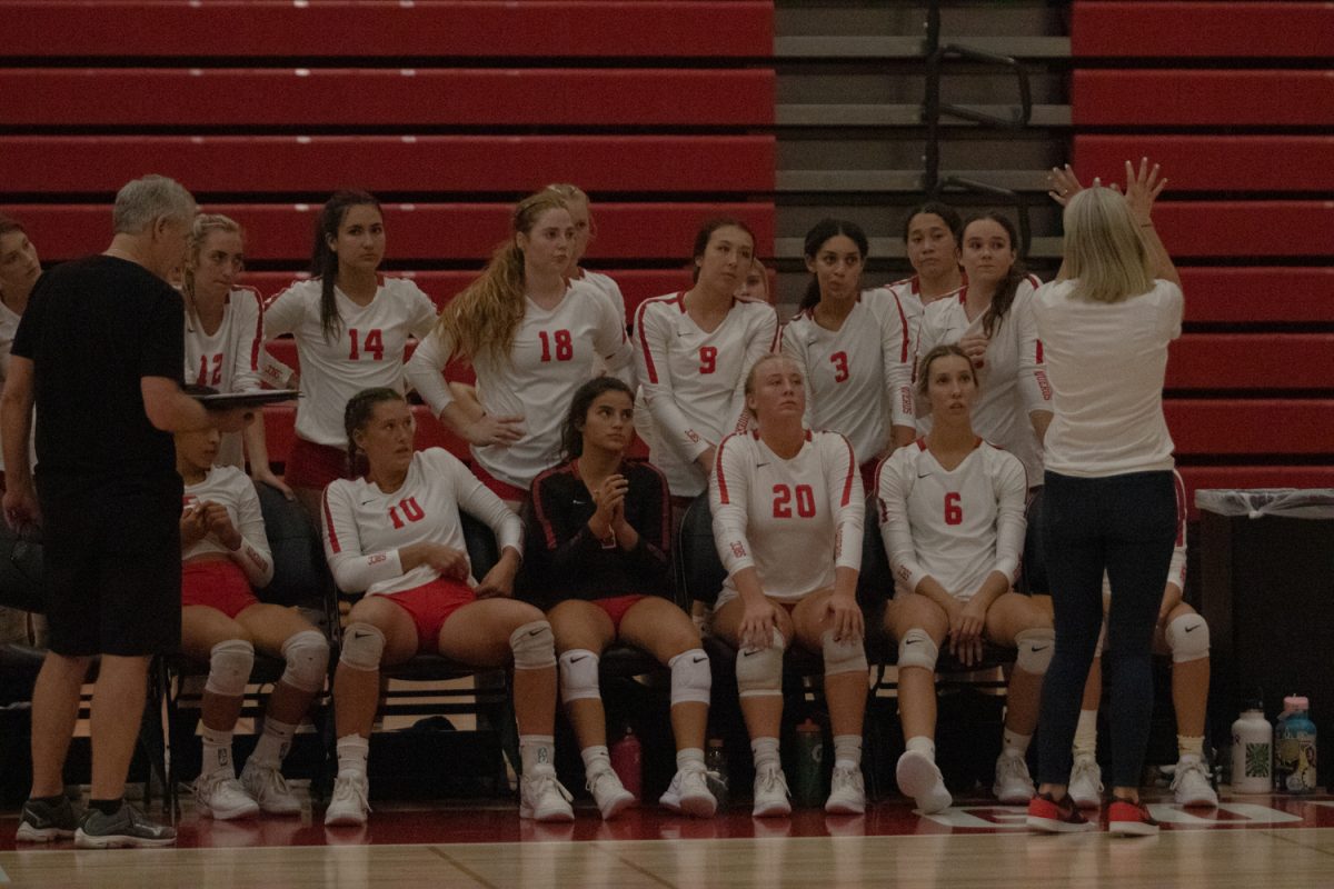 Head Coach Kat Niksto demonstrates proper blocking technique to the Vaqueros during their match against Moorpark College on Sept. 29 in Santa Barbara, Calif. With firm hands and spread fingers, this technique helps to block incoming hits from the opposing team.