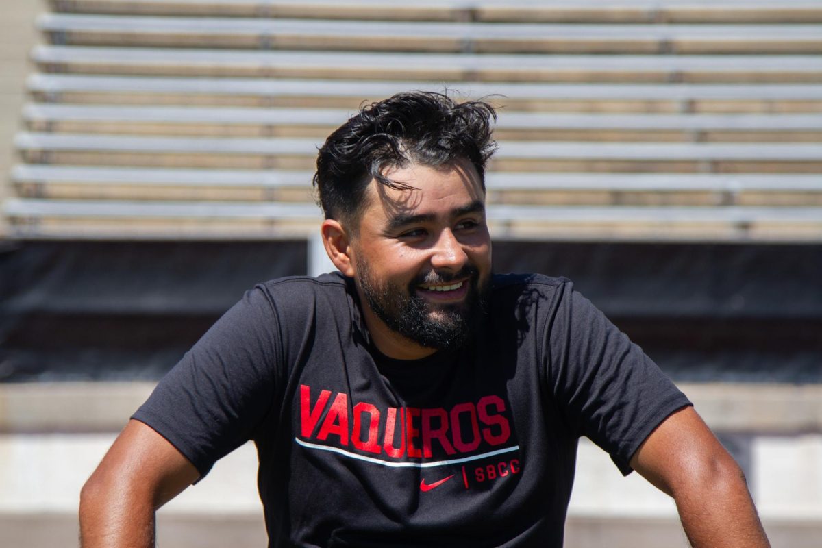 Alex Zermeno, head coach of City College’s women’s and men’s soccer teams, smiles towards his athletes at practice as they tease and praise him on Thursday, Sept. 7, in Santa Barbara, Calif. Zermeno has been appointed head coach of the Vaqueros for the first time this season.
